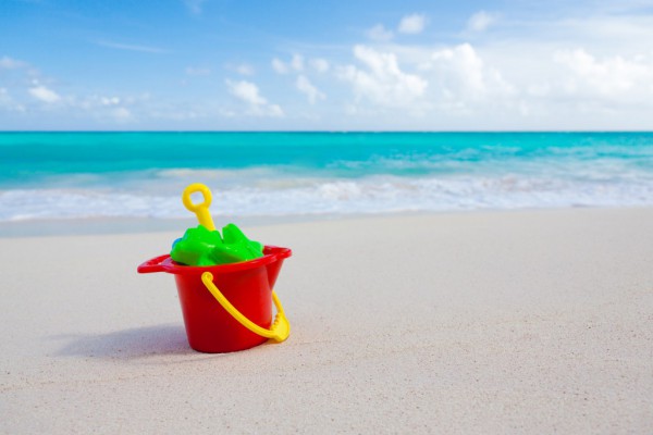 bucket and toys on beach