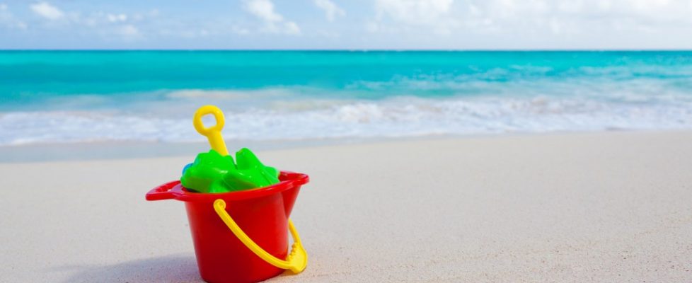 bucket and toys on beach